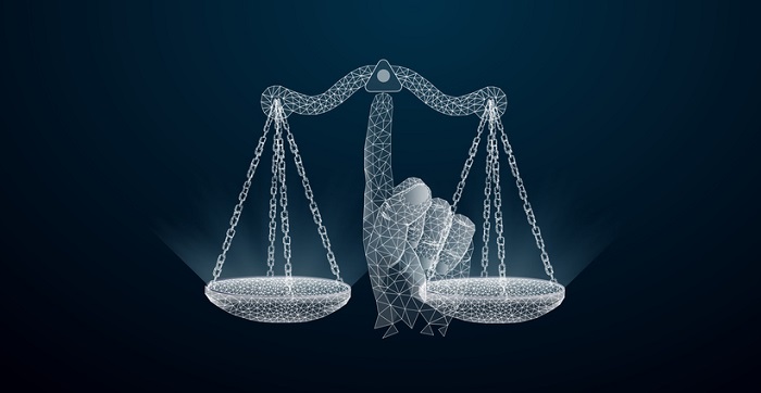 Abstract image of a Scales of justice in the form of a  wireframe on the index finger, consisting of , lines, and shapes. Vector wireframe concept.